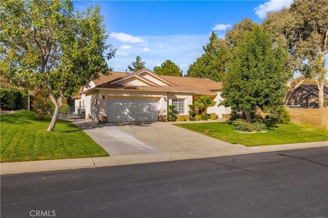 single story home with a garage, driveway, fence, and a front lawn