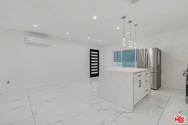 kitchen featuring a wall mounted AC, a kitchen island, white cabinetry, stainless steel refrigerator with ice dispenser, and decorative light fixtures