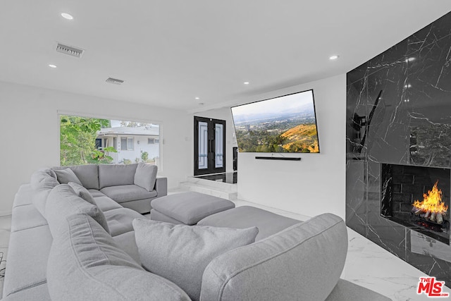 living room featuring a fireplace