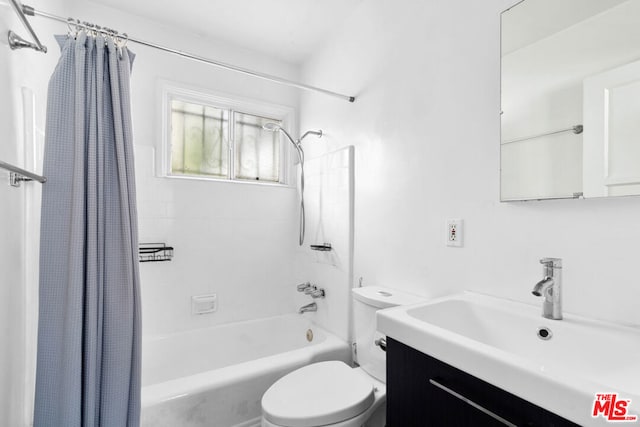 full bathroom featuring vanity, toilet, and shower / bathtub combination with curtain