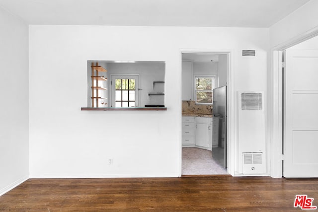 empty room featuring dark wood-type flooring