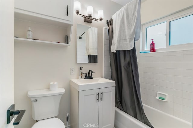 full bathroom with toilet, vanity, and shower / tub combo