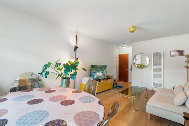 dining space with light hardwood / wood-style flooring