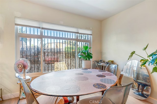 dining space with light hardwood / wood-style flooring