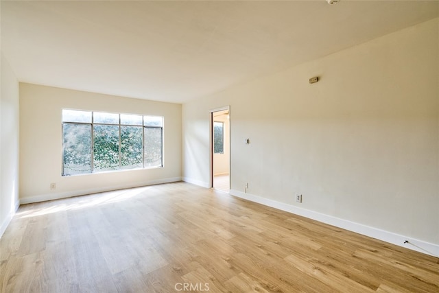 spare room featuring light hardwood / wood-style floors