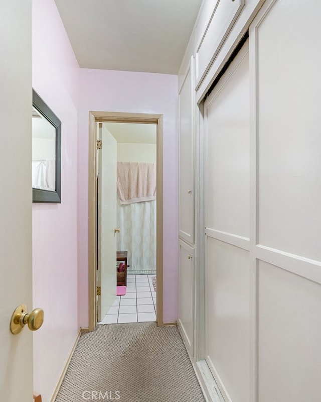 hallway with light carpet