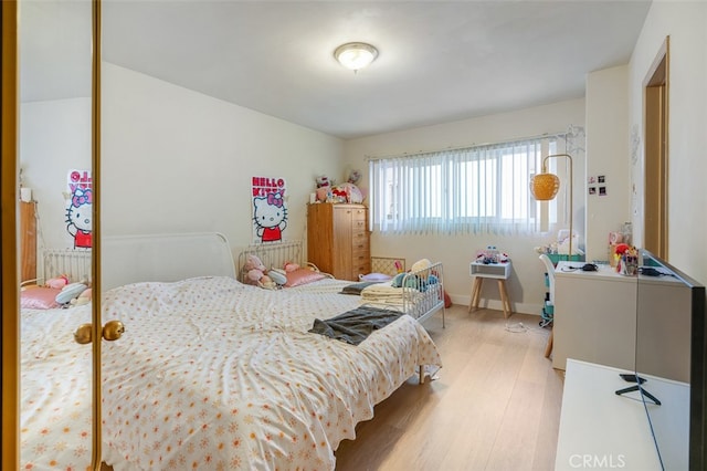 bedroom with light hardwood / wood-style floors