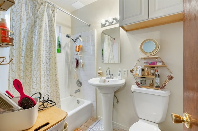 full bathroom with tile patterned floors, sink, shower / bath combo, and toilet