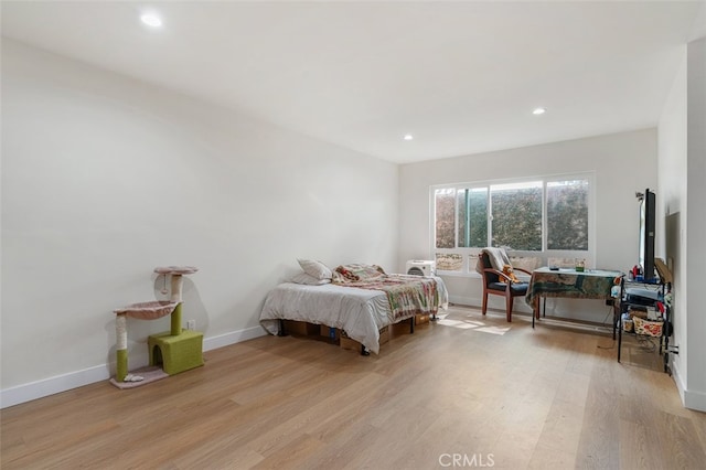 bedroom with light wood-type flooring