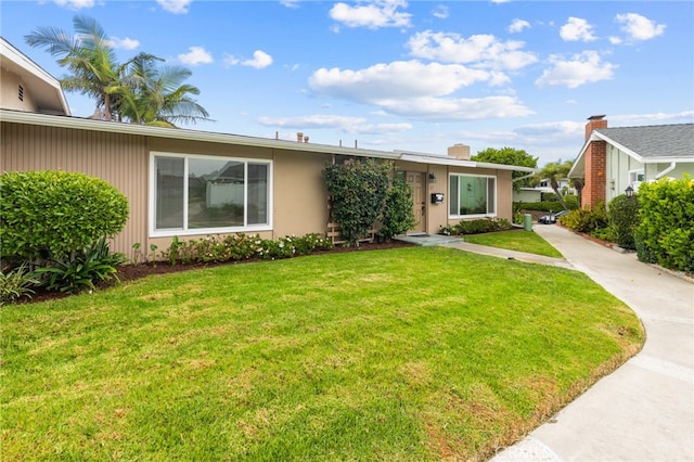 ranch-style home with a front yard