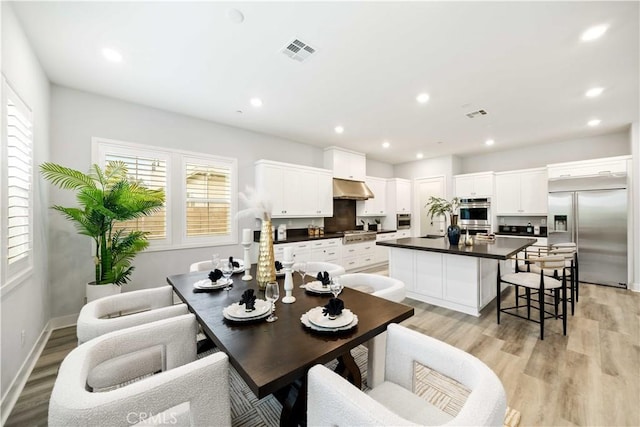 dining room featuring light hardwood / wood-style flooring