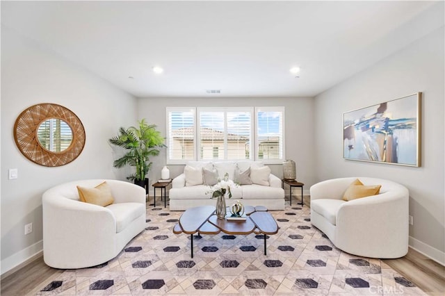 living room with light hardwood / wood-style flooring