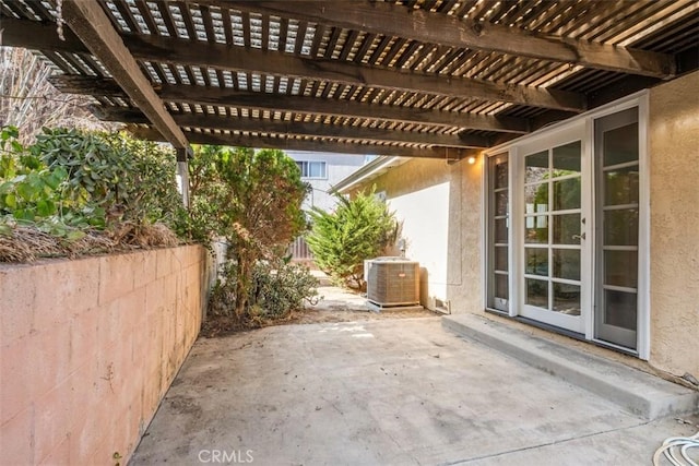 view of patio / terrace with cooling unit and a pergola