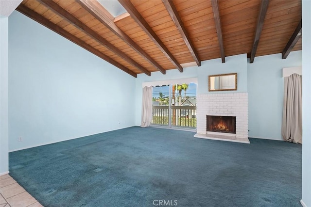 unfurnished living room with a fireplace, carpet, lofted ceiling with beams, and wood ceiling