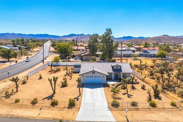 birds eye view of property featuring a mountain view