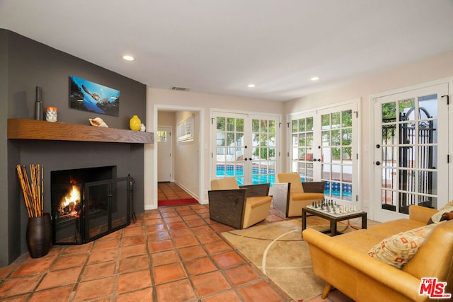 living room featuring french doors and tile patterned flooring