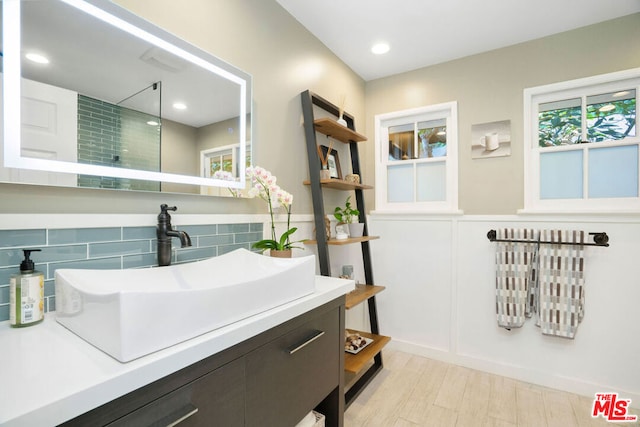 bathroom with vanity and hardwood / wood-style floors