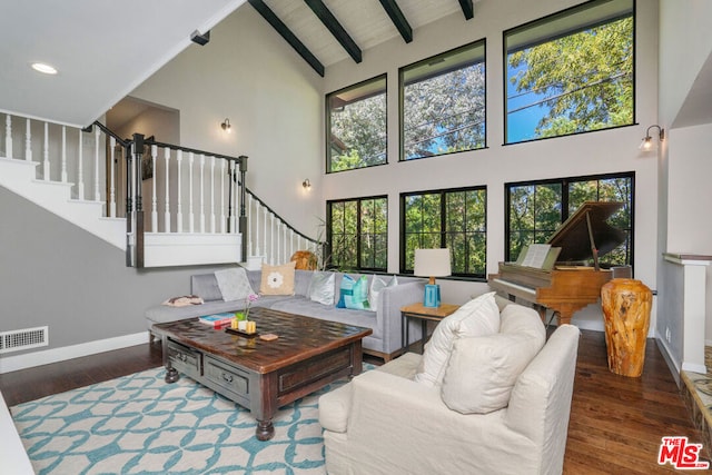 living room featuring high vaulted ceiling, dark hardwood / wood-style flooring, beamed ceiling, and wooden ceiling