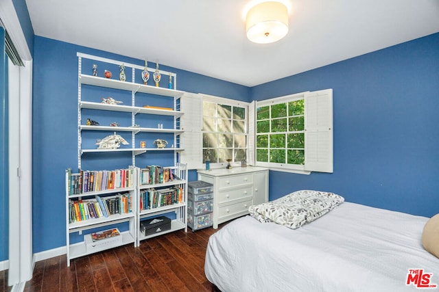 bedroom featuring dark wood-type flooring