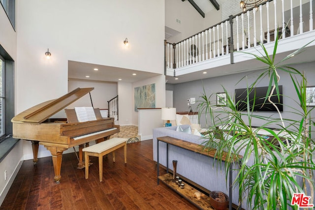 miscellaneous room featuring high vaulted ceiling, wood-type flooring, and beam ceiling