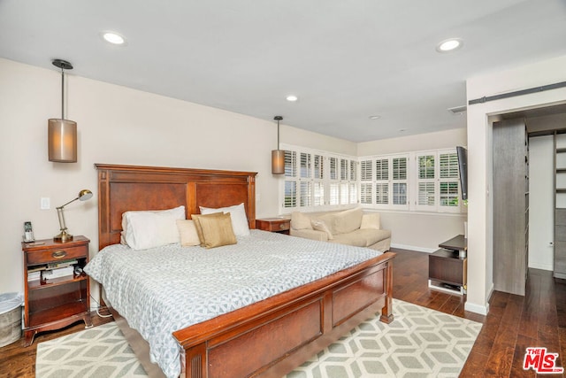 bedroom featuring dark hardwood / wood-style flooring