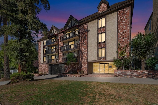 view of outdoor building at dusk