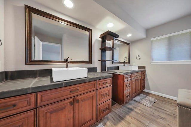 bathroom with vanity and hardwood / wood-style flooring