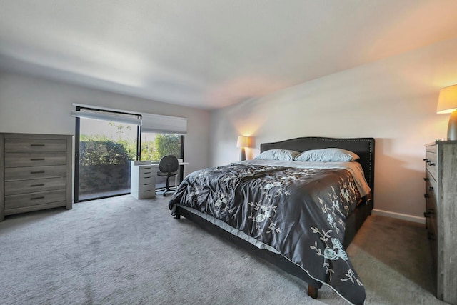 carpeted bedroom featuring access to outside