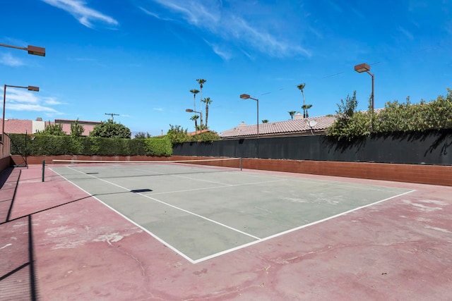 view of tennis court featuring basketball court