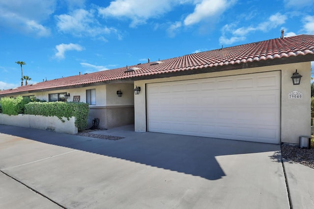 ranch-style home with a garage