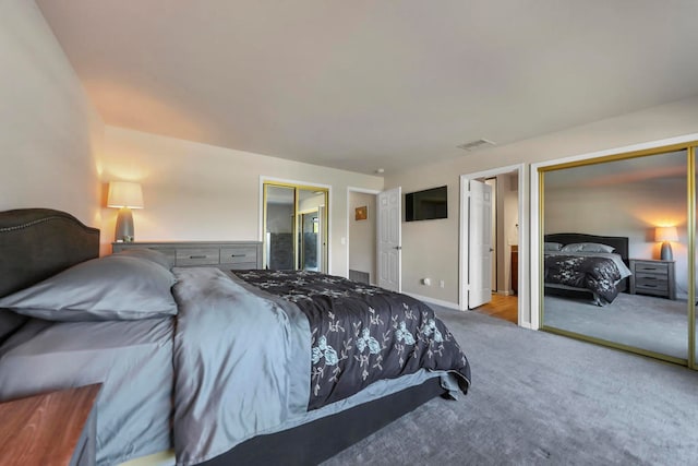 bedroom featuring ensuite bathroom and carpet floors