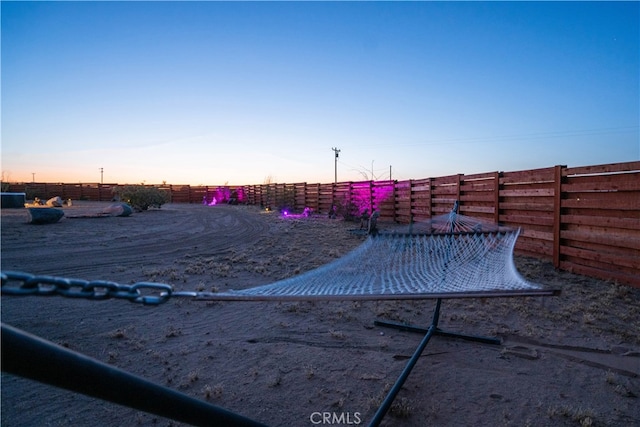 view of yard at dusk