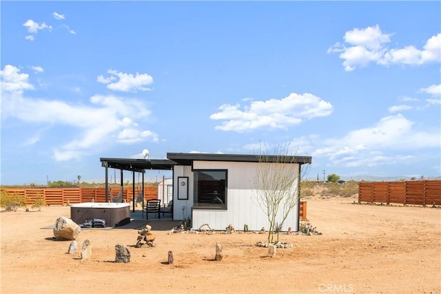 view of outdoor structure with a hot tub