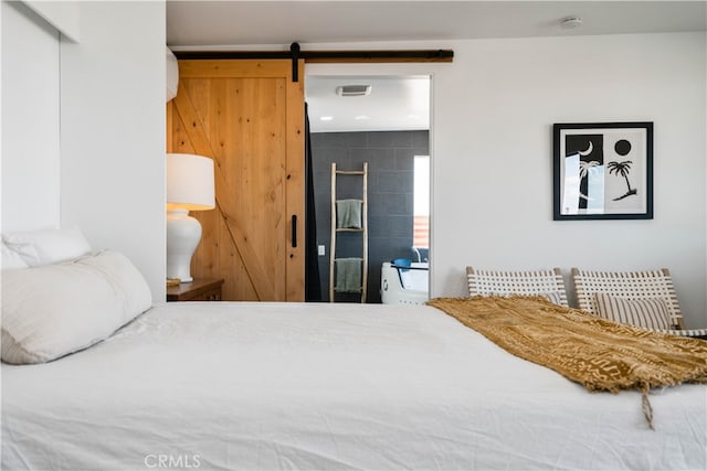 bedroom with a barn door