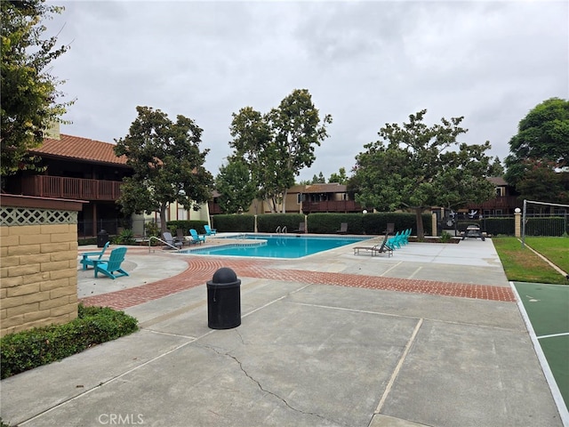 view of swimming pool featuring a patio area