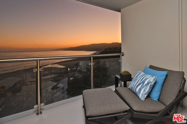 balcony at dusk with a water view