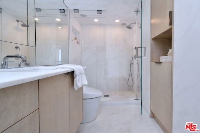 bathroom featuring walk in shower, vanity, and toilet