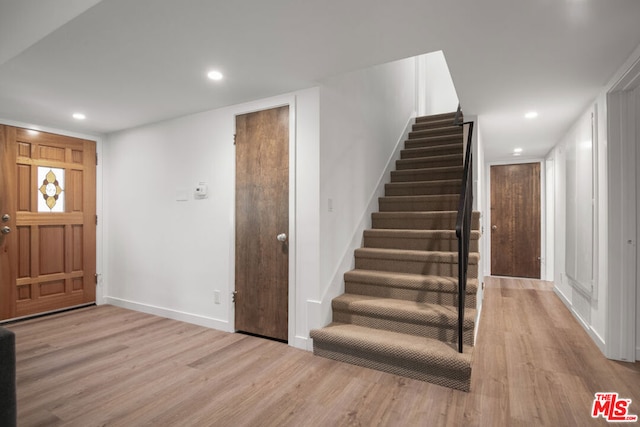 entryway with light hardwood / wood-style floors