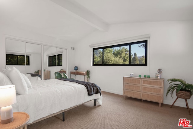 bedroom featuring carpet and vaulted ceiling with beams