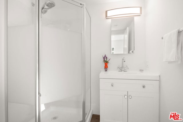 bathroom with vanity and an enclosed shower