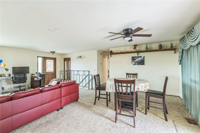 living room featuring light carpet and ceiling fan