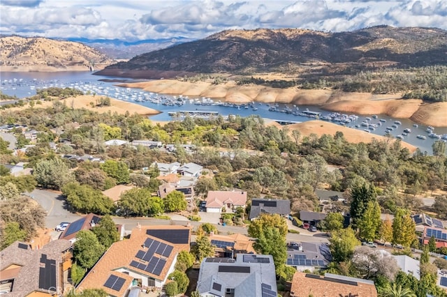 bird's eye view with a water and mountain view