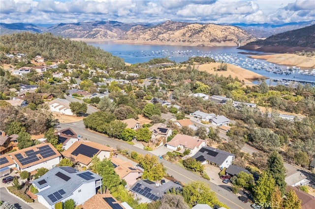 birds eye view of property featuring a water and mountain view