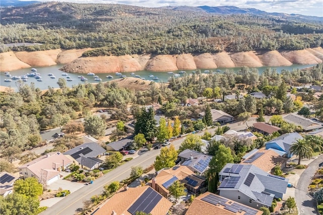 bird's eye view with a water and mountain view