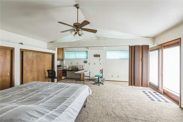 bedroom featuring ceiling fan, vaulted ceiling, and carpet floors