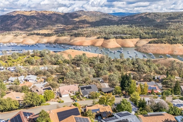 bird's eye view featuring a water and mountain view