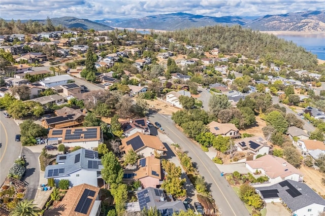 birds eye view of property featuring a water and mountain view