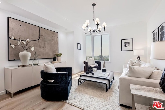 living room featuring light hardwood / wood-style floors and a notable chandelier