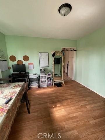 bedroom with hardwood / wood-style flooring