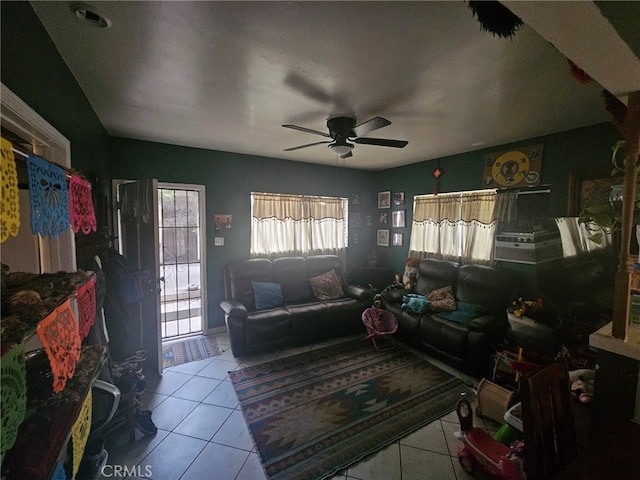 living room featuring ceiling fan and light tile patterned floors